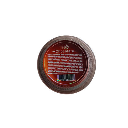 Vela de masaje Pheromone Massage Candle sabor chocolate, vista lateral con tapa negra y etiqueta café