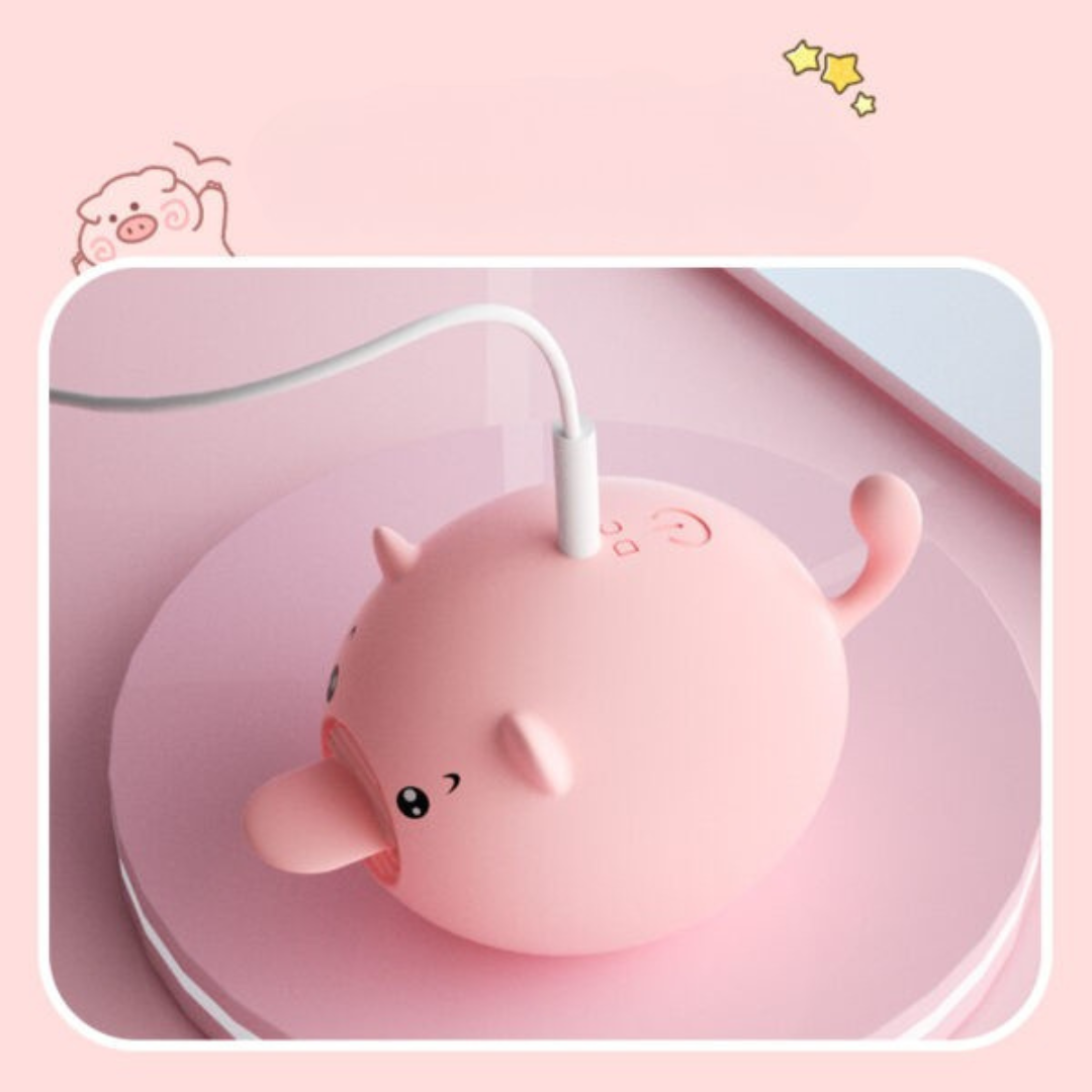 Sweet Pig estimulador oral cargando via USB